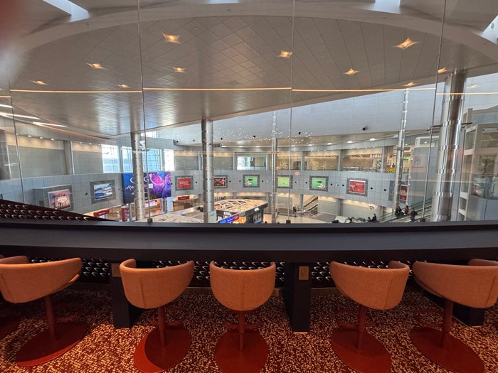 Capital One Lounge Las Vegas seats facing atrium Capital One Lounge Las Vegas seats facing atrium
