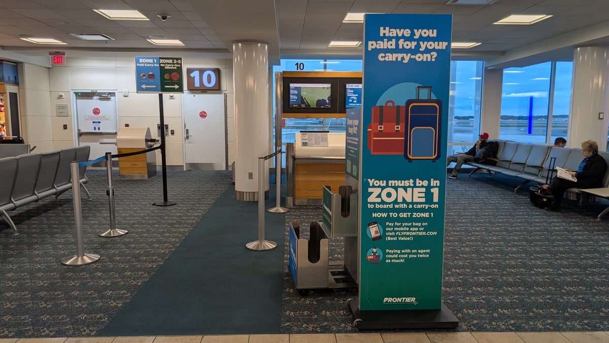 Frontier Airlines carry on bag and sizer at the gate