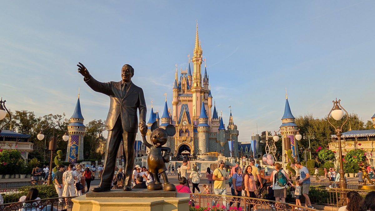 Walt Disney World Magic Kingdom Cinderella's Castle with Walt Disney and Mickey statue