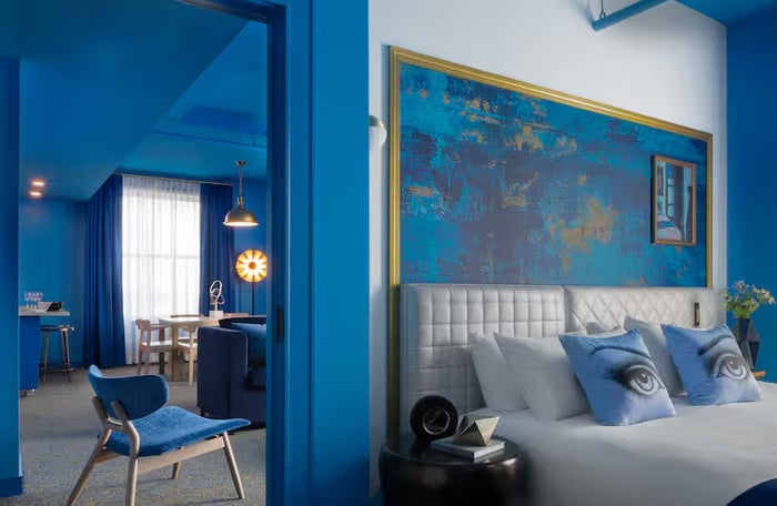 Angad Arts Hotel grand suite 1 bed bedroom blue