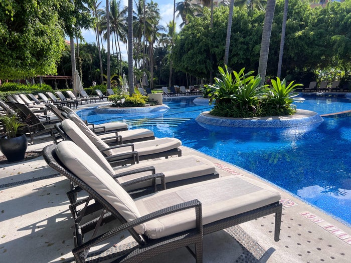Westin Puerto Vallarta cushioned lounge chairs at pool Westin Puerto Vallarta cushioned lounge chairs at pool