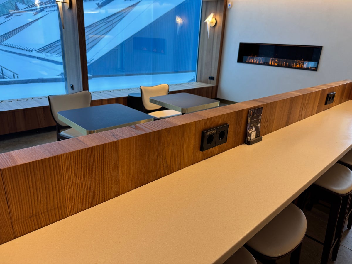 Airport Lounge by LHV TLL seating near fireplace