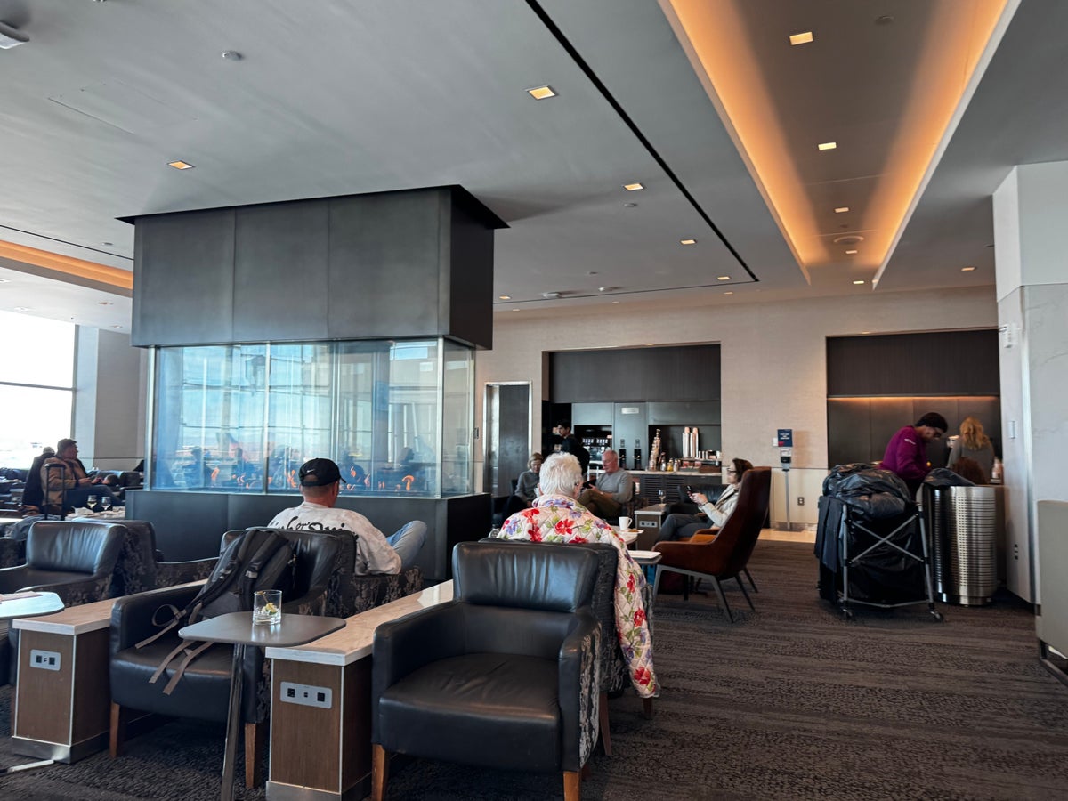 Delta Sky Club SLC Concourse A fireplace seating area
