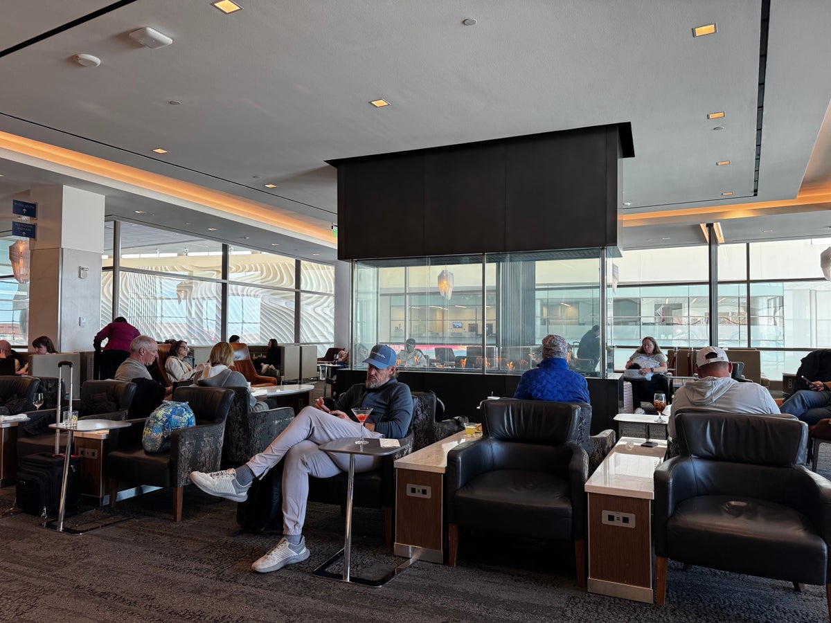Delta Sky Club SLC Concourse A seating near fireplace
