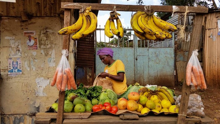 Lady selling fruit Kibera Nairobi Lady selling fruit Kibera Nairobi