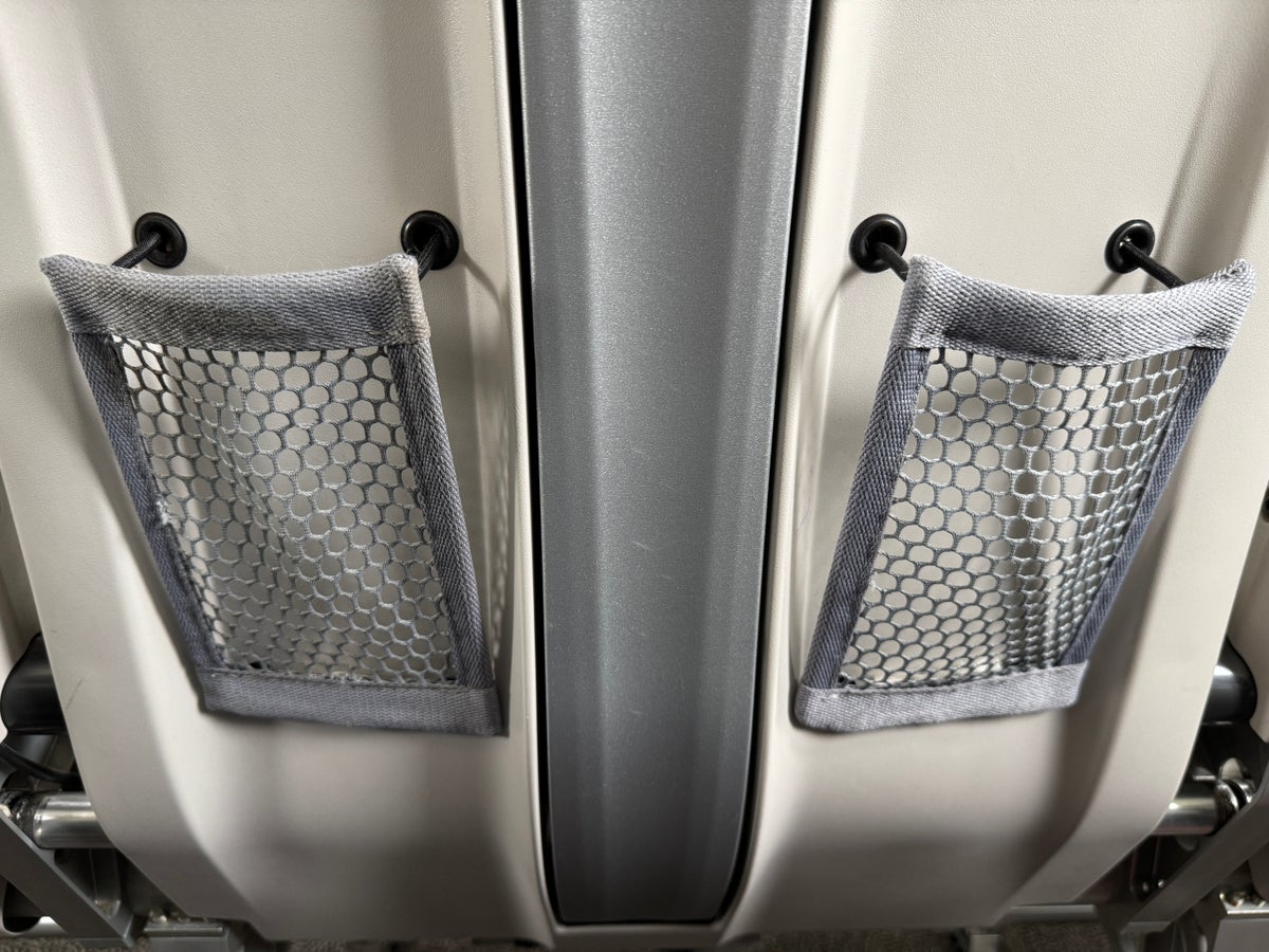 airBaltic A220 300 TLL OSL netted pockets