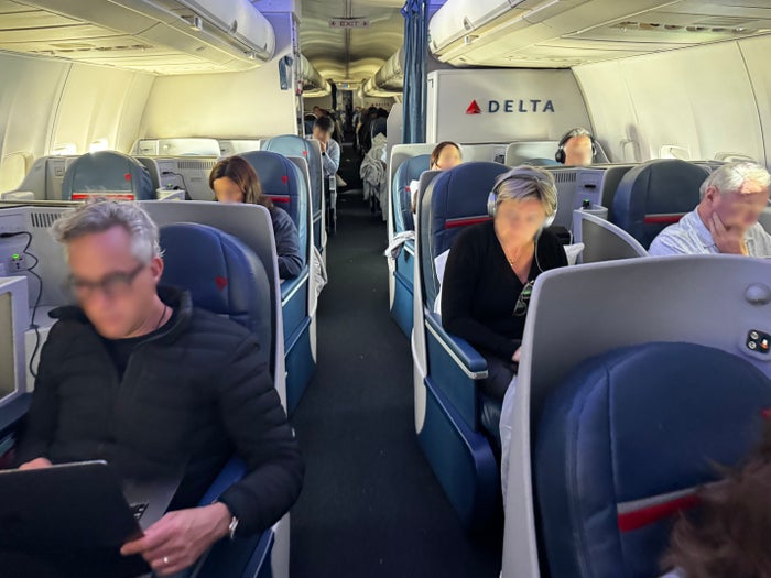 Delta One B757 200 LAX BOS front aisle view Delta One B757 200 LAX BOS front aisle view