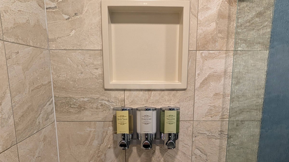 Disneys Yacht Club Resort guest room bathroom shower toiletries and shelf