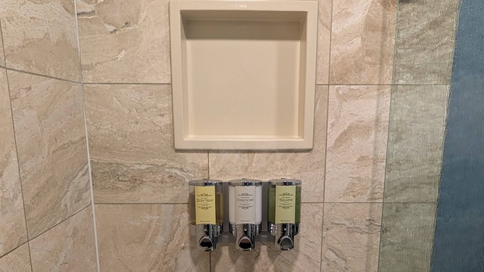 Disneys Yacht Club Resort guest room bathroom shower toiletries and shelf Disneys Yacht Club Resort guest room bathroom shower toiletries and shelf