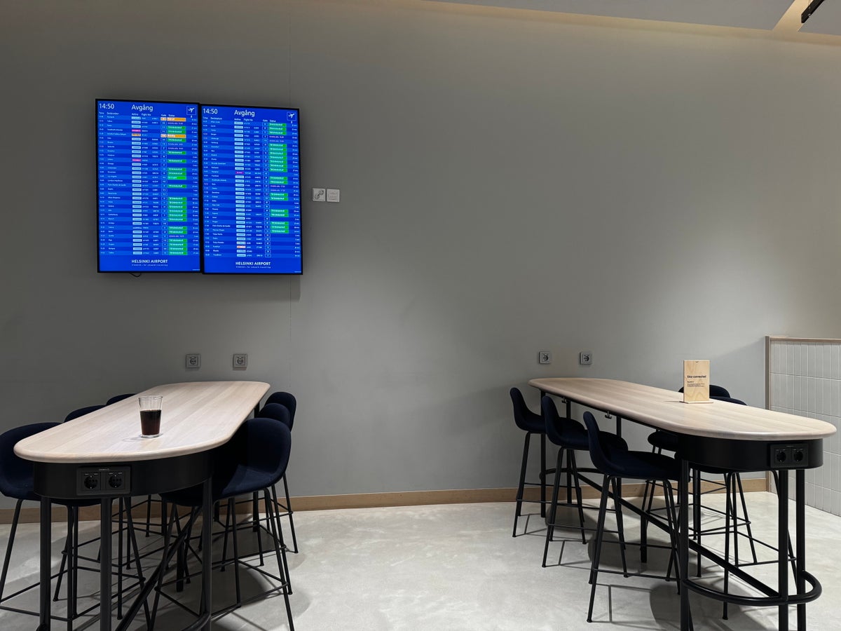 Finnair Lounge Helsinki HEL Non Schengen tables departure boards