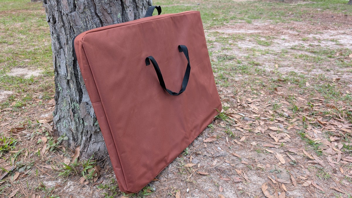 Folded up dog bed for camping