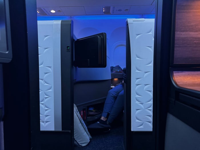 JetBlue Mint A321XLR BOS MAD view through suite door
