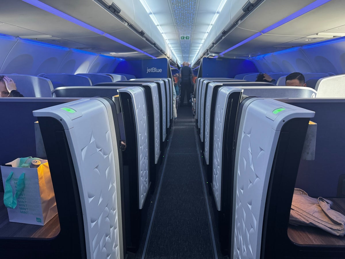 JetBlue Mint A321XLR BOS MAD view to rear lit cabin