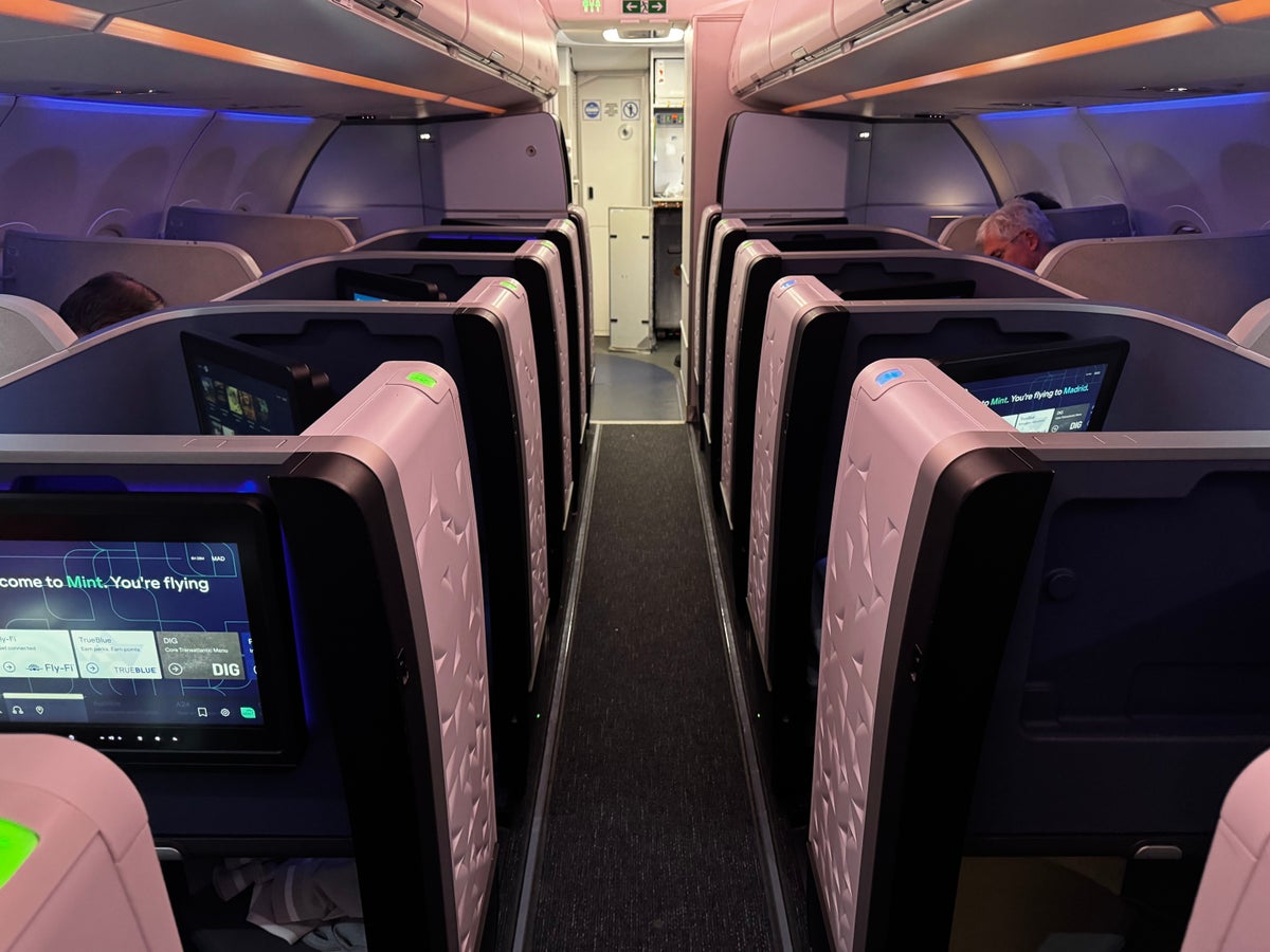 JetBlue Mint A321XLR BOS MAD view up aisle lit