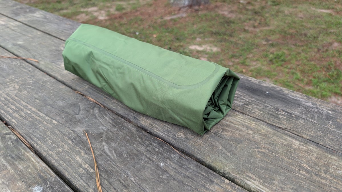 Self inflating sleeping pad rolled up