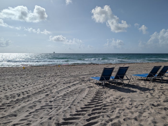 Female traveler looking at mountains W Fort Lauderdale amenities beach view