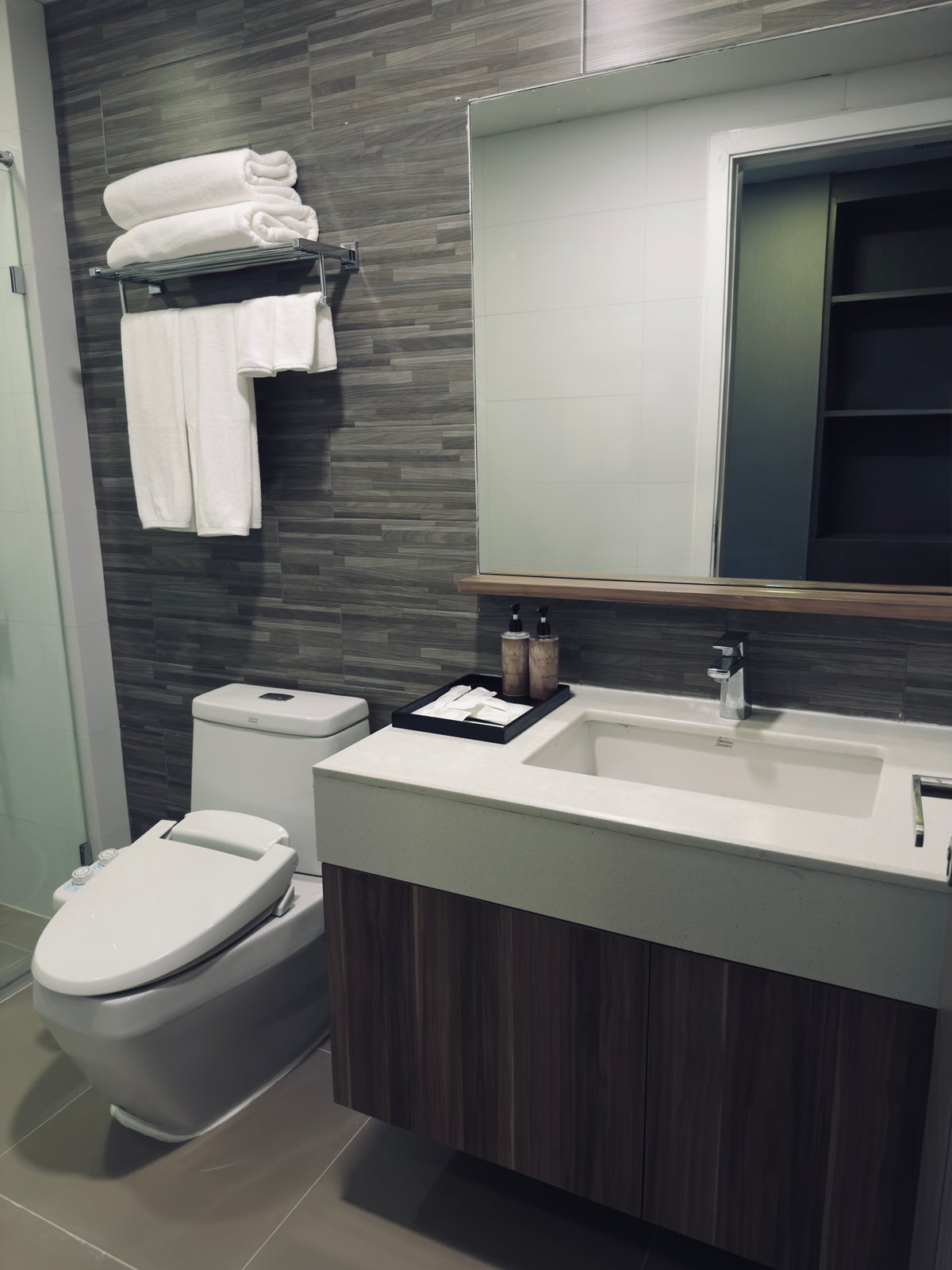 Metropolis Suites Bangkok room bathroom vanity and toilet