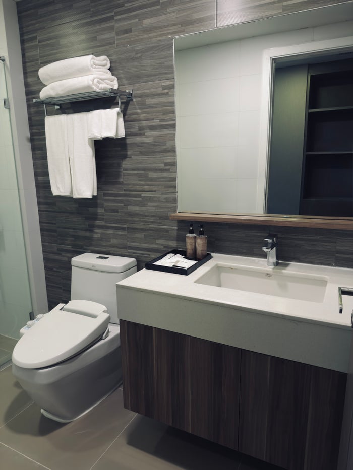 Metropolis Suites Bangkok room bathroom vanity and toilet Metropolis Suites Bangkok room bathroom vanity and toilet