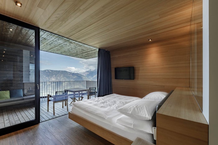 view of Tyrolean Mountains in Italy from hotel Miramonti Boutique Hotel guest room
