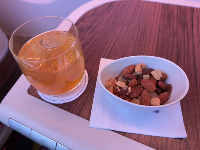 Thai Airways Royal Silk beverage and nuts Thai Airways Royal Silk beverage and nuts