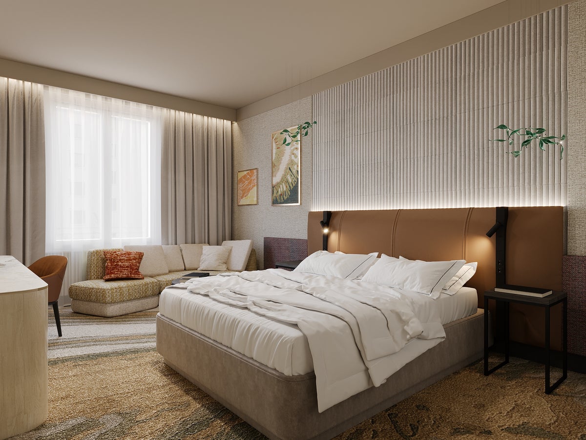 rendering of a guest room at crowne plaza paris marne la vallee