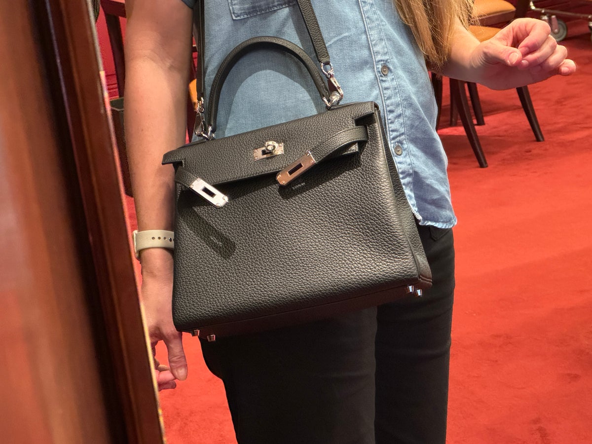 Hermes Paris trying on bag