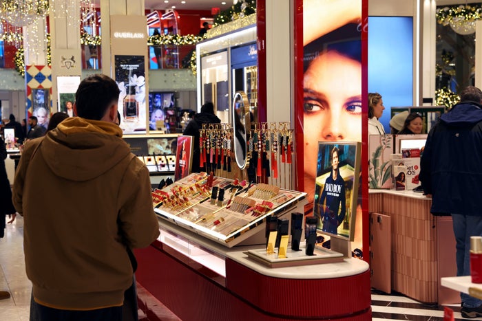 Shoppers with bags Macy's shopping Badboy cosmetics