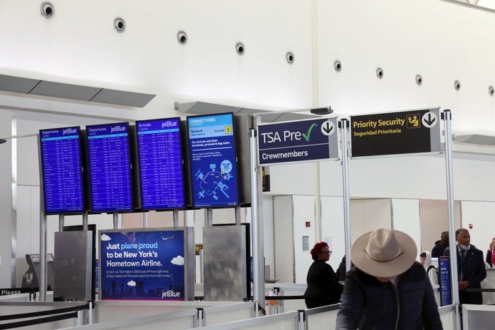 TSA PreCheck priority security gate JFK Terminal 5 hat man