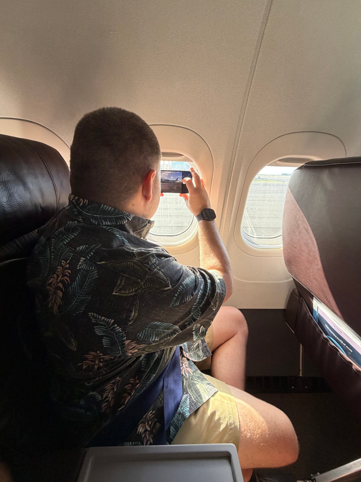 Taking a Picture Out the Window Hawaiian Airlines