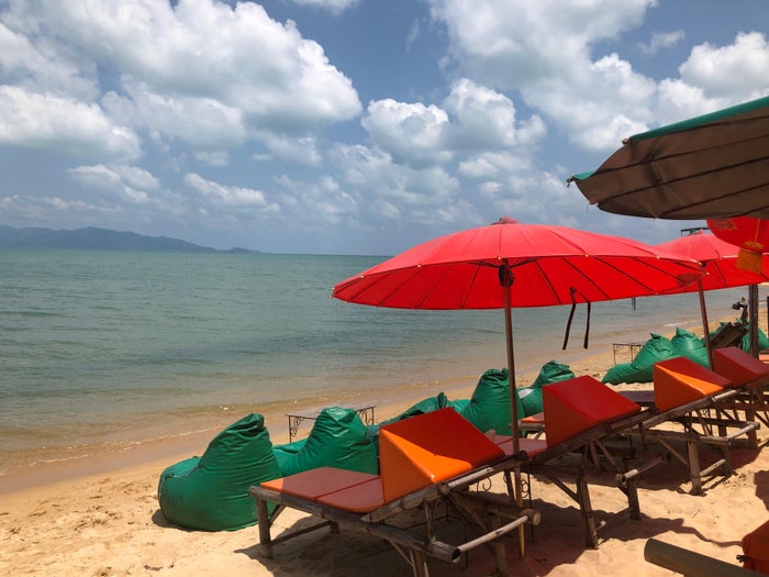 Beach in Koh Samui with chairs and umbrellas Beach in Koh Samui with chairs and umbrellas