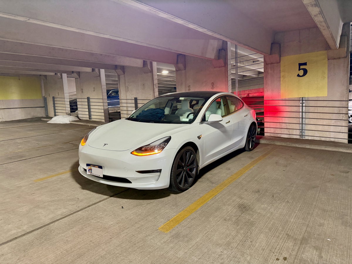 Tesla Model 3 in a parking garage
