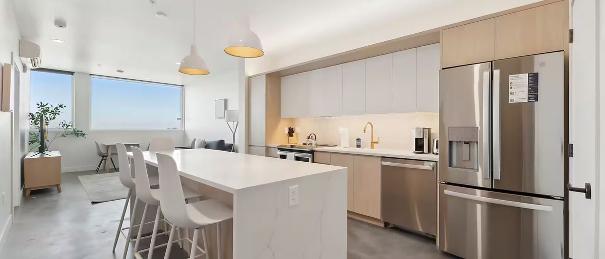 saut001 guestroom two bedroom with hot tub kitchen white island stainless appliances conversion1