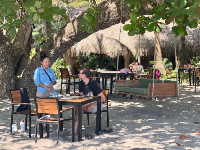 Isla Palenque Panama ordering lunch