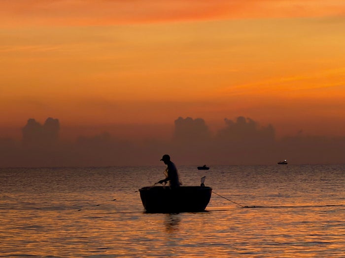 Four Seasons The Nam Hai fisherman at sunrise Four Seasons The Nam Hai fisherman at sunrise