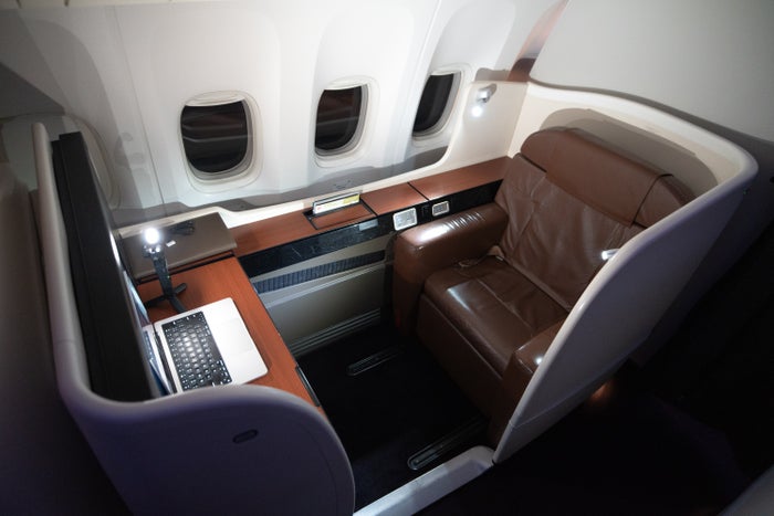 Japan Airlines 777 first seat above Japan Airlines 777 first seat above