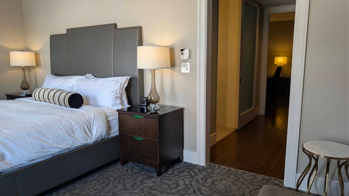 St. Anthony Hotel San Antonio guest room junior suite bedroom looking into hallway