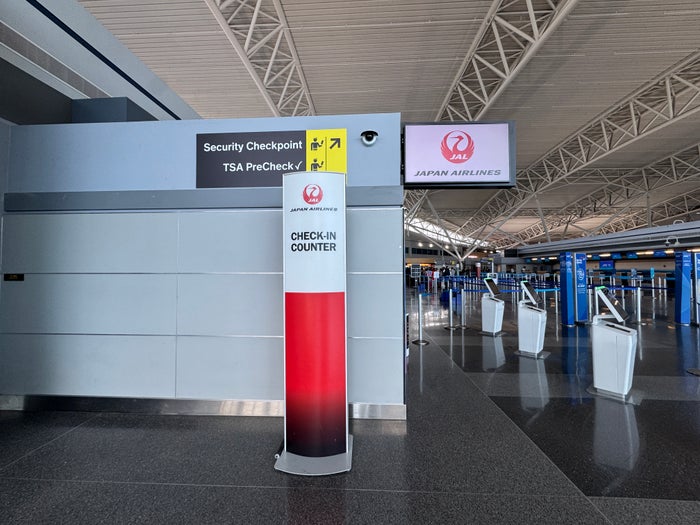 Japan Airlines Check in Counter sign Japan Airlines Check in Counter sign