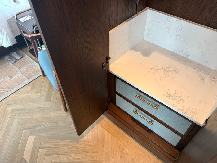 Six Senses London bedroom luggage shelf